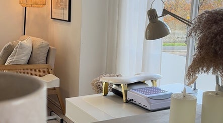 Inviting nail station at The Gel Club, Stamford, England, GB, with warm lighting and comfortable seating.