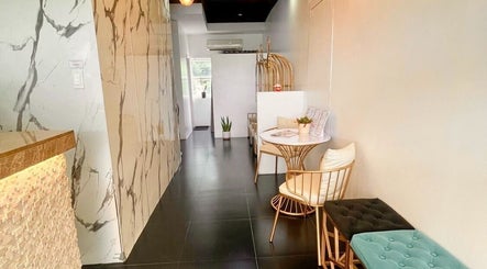 Chic reception area of CLG Aesthetics Fairview in Quezon City, Metro Manila, PH, with modern décor and seating.