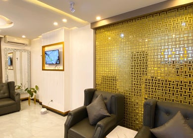 Luxurious interior of CLG Aesthetics Marikina, Metro Manila, PH, featuring elegant seating and gold accents.