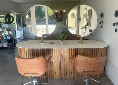 Elegant hairstyling station at Hair Twenty-Two, Bridport, England, GB. Modern decor enhances client experience.