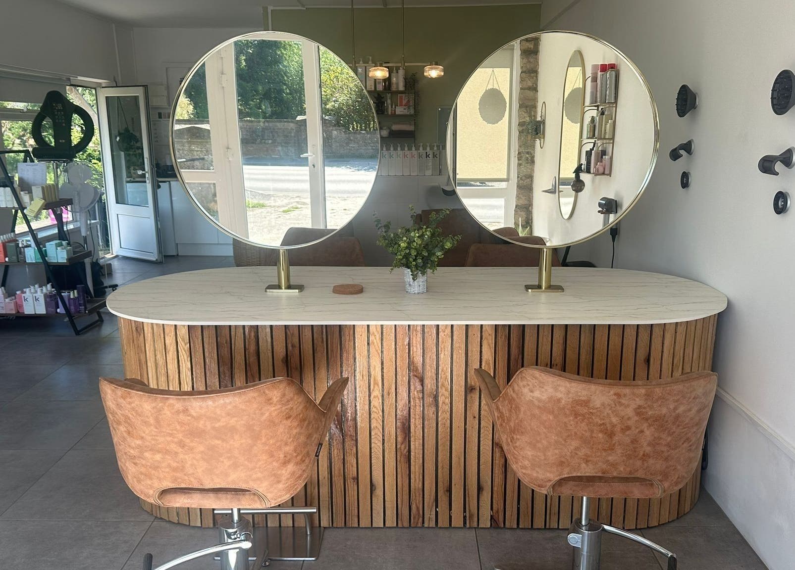 Elegant hairstyling station at Hair Twenty-Two, Bridport, England, GB. Modern decor enhances client experience.