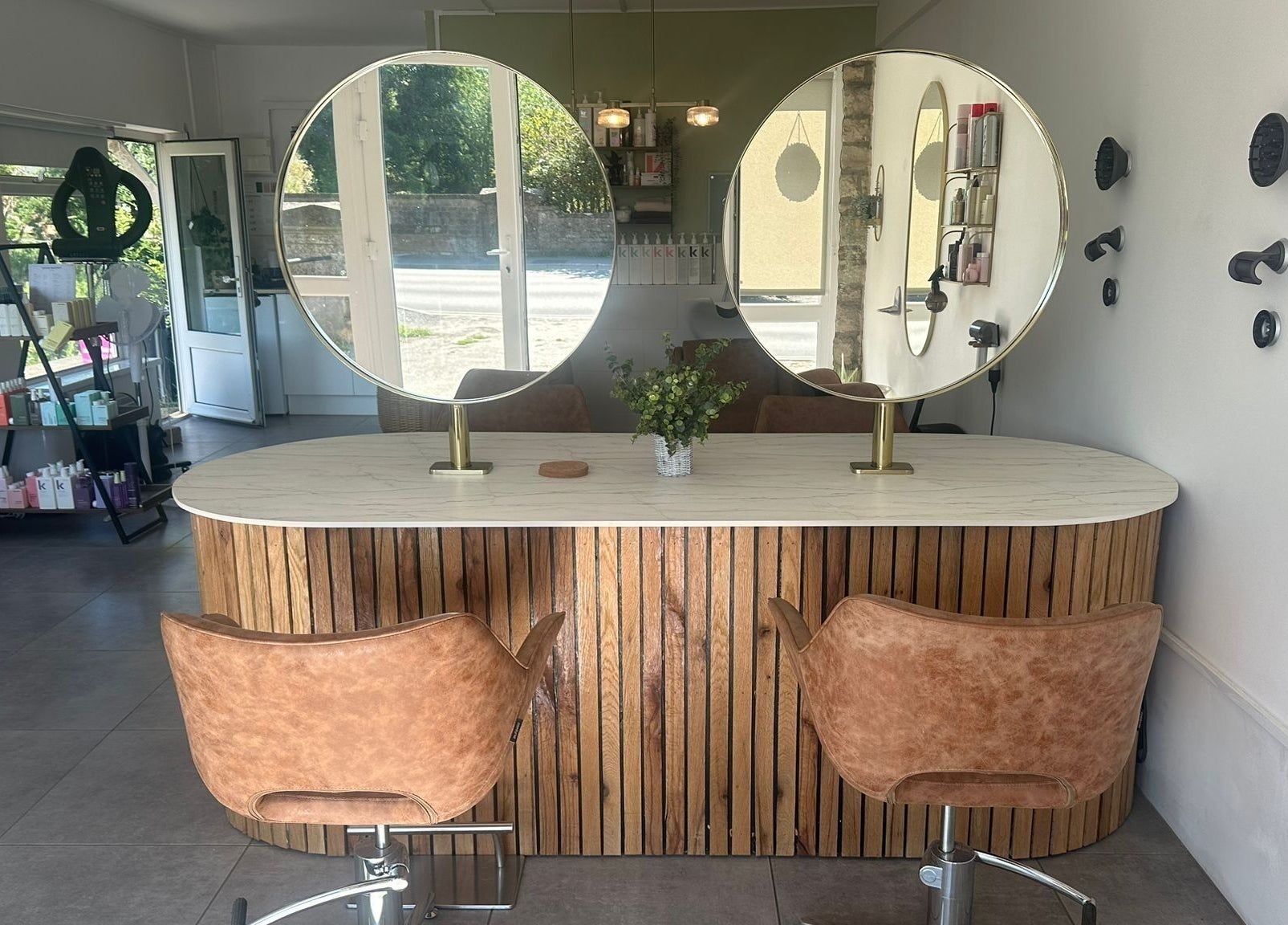 Elegant hairstyling station at Hair Twenty-Two, Bridport, England, GB. Modern decor enhances client experience.