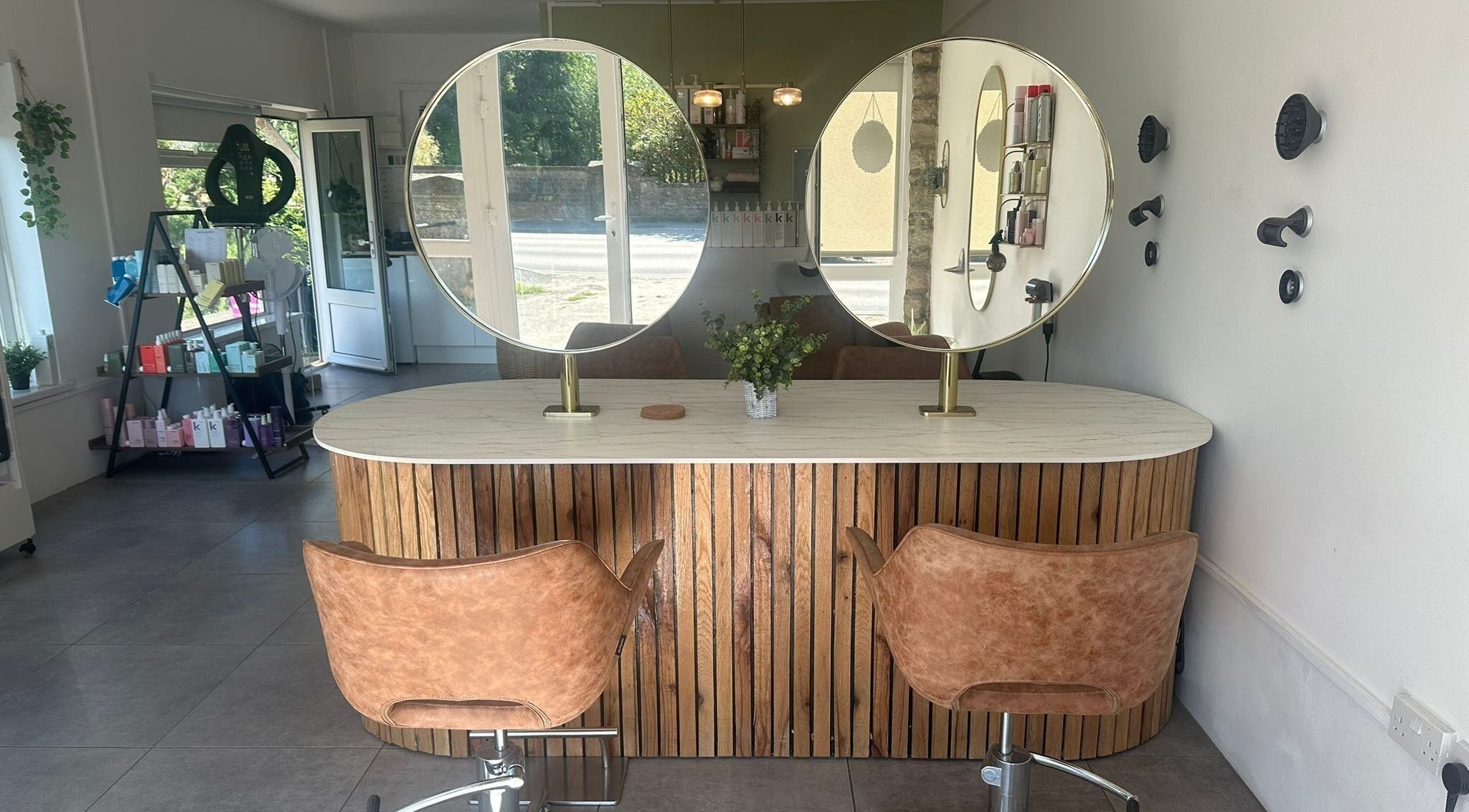 Elegant hairstyling station at Hair Twenty-Two, Bridport, England, GB. Modern decor enhances client experience.