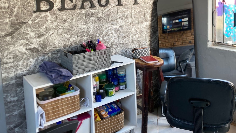 Relaxing corner at TT Beauty, Meadowlands West, Gauteng, ZA with products and seating.