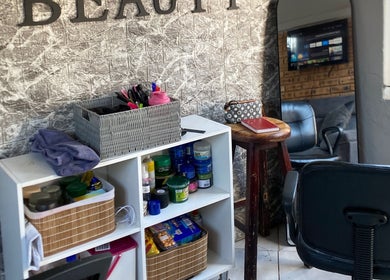 Relaxing corner at TT Beauty, Meadowlands West, Gauteng, ZA with products and seating.