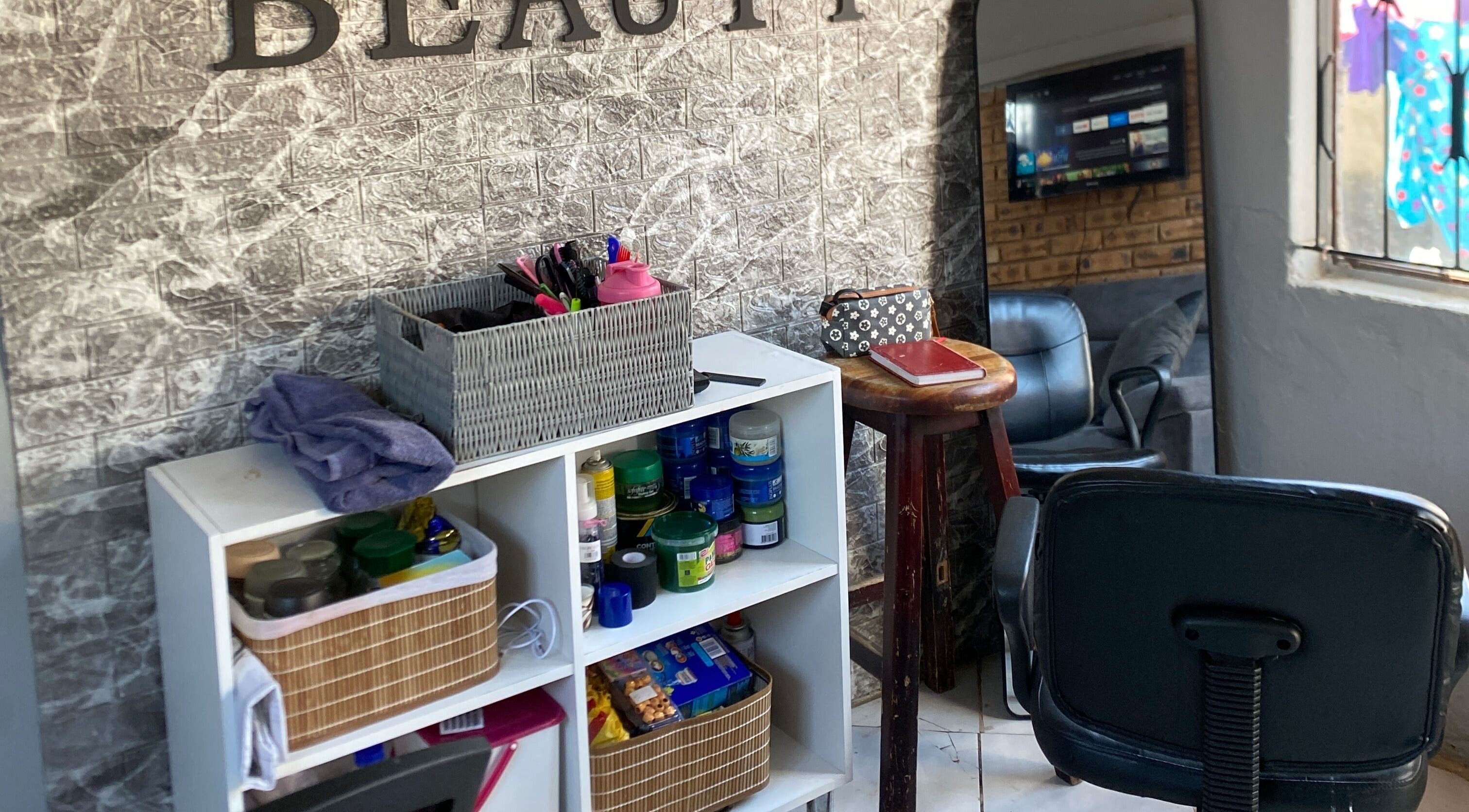 Relaxing corner at TT Beauty, Meadowlands West, Gauteng, ZA with products and seating.