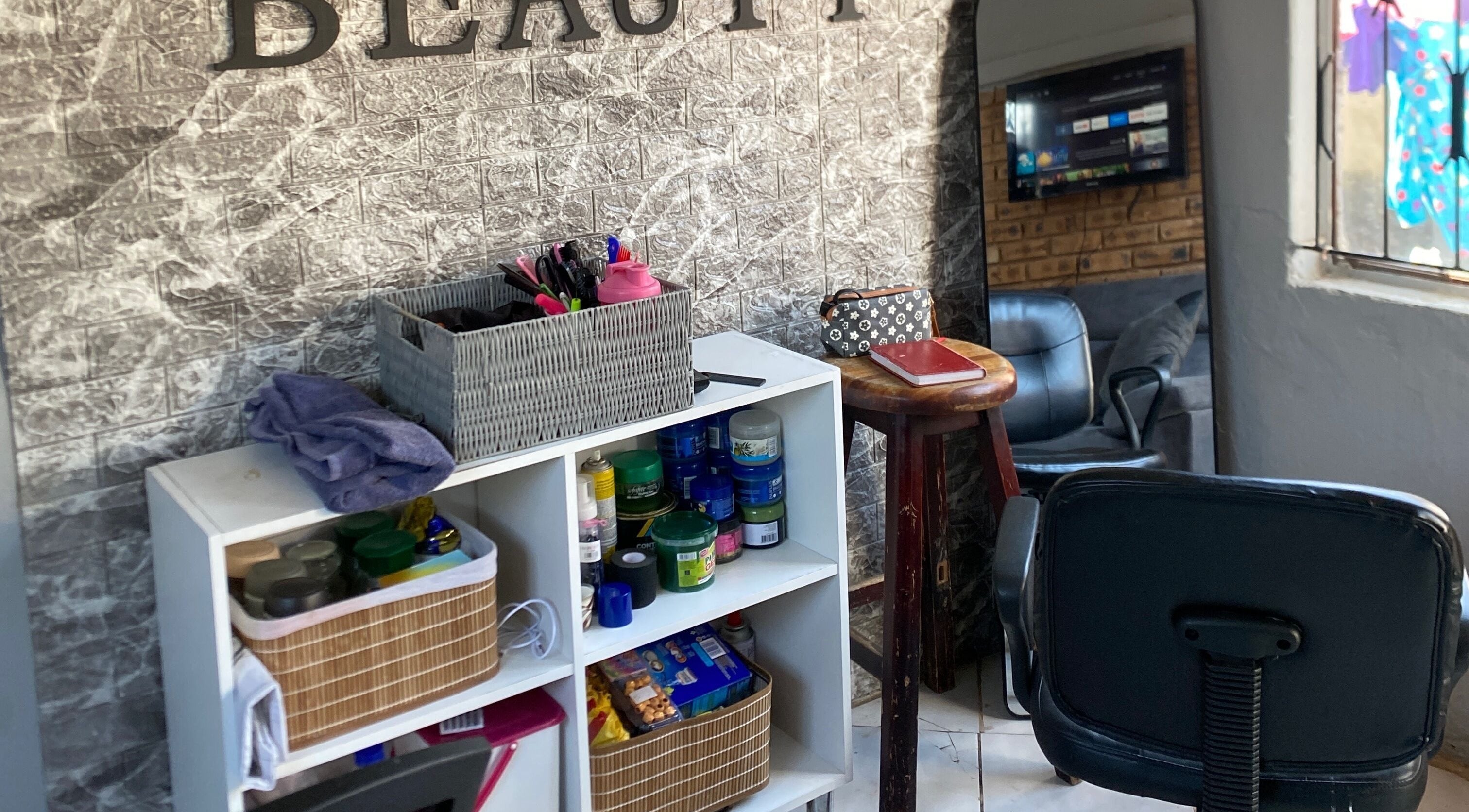 Relaxing corner at TT Beauty, Meadowlands West, Gauteng, ZA with products and seating.