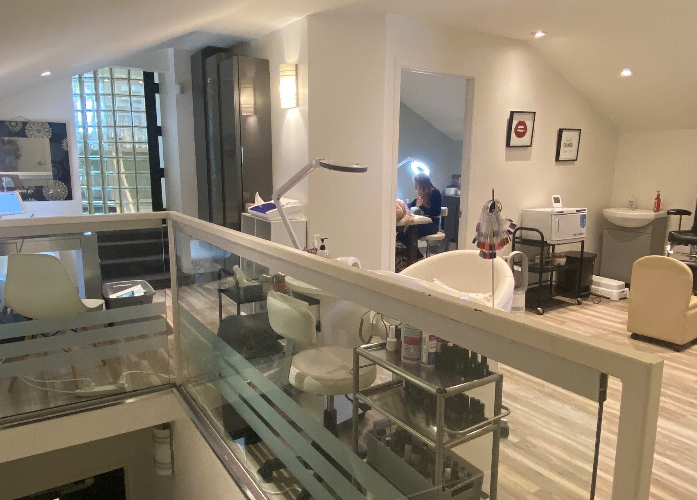 Modern interior of The Lash Lounge in St. Catharines, Ontario, CA with elegant beauty treatment areas.