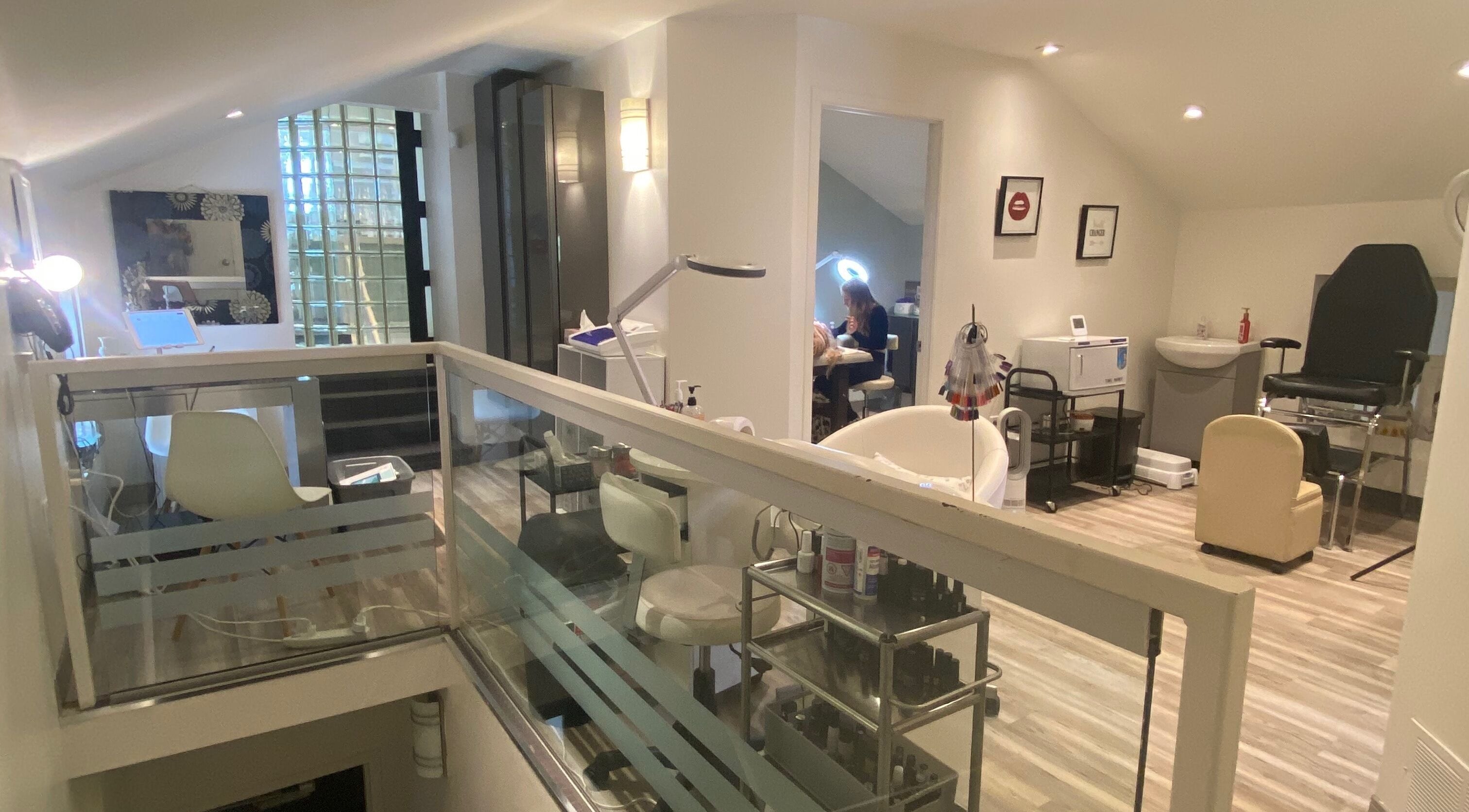 Modern interior of The Lash Lounge in St. Catharines, Ontario, CA with elegant beauty treatment areas.