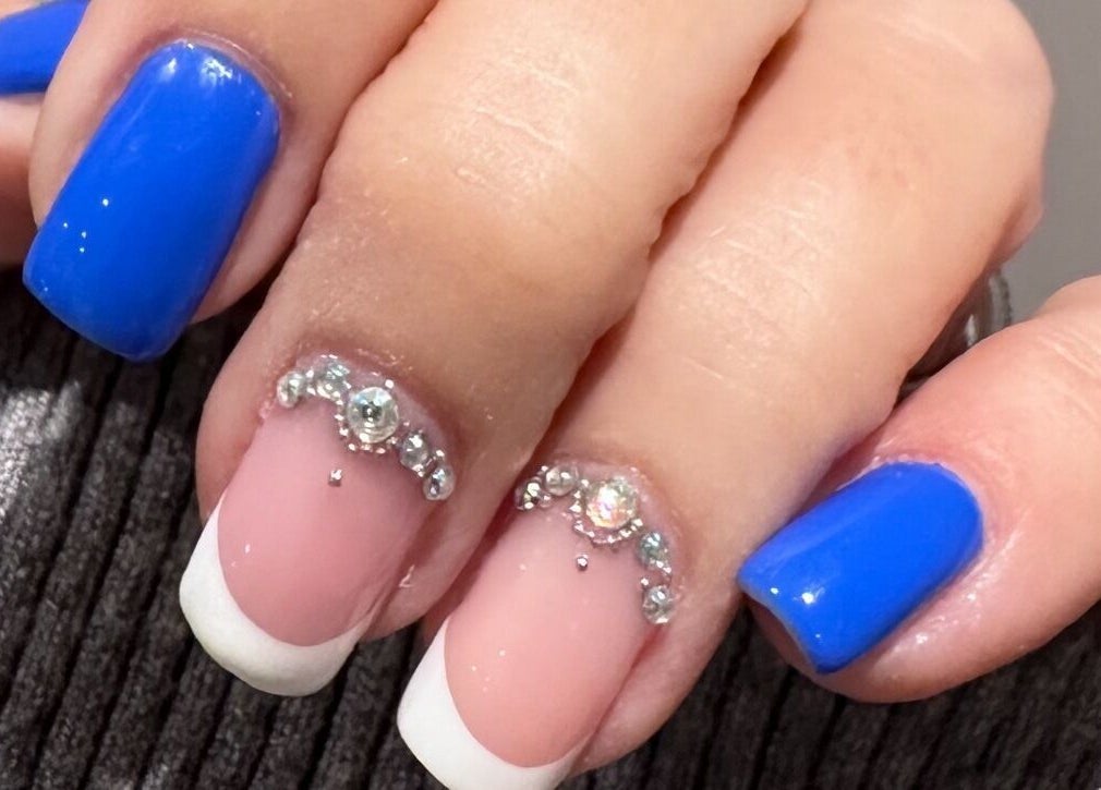 Intricate nail design with blue polish at The Lash Lounge, St. Catharines, Ontario, CA.