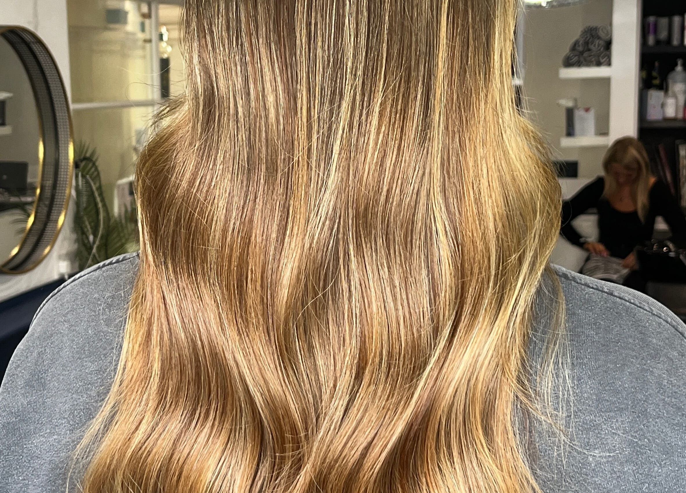 Golden hair waves styled at JR Hair Studio, Walnut Tree, England, GB.