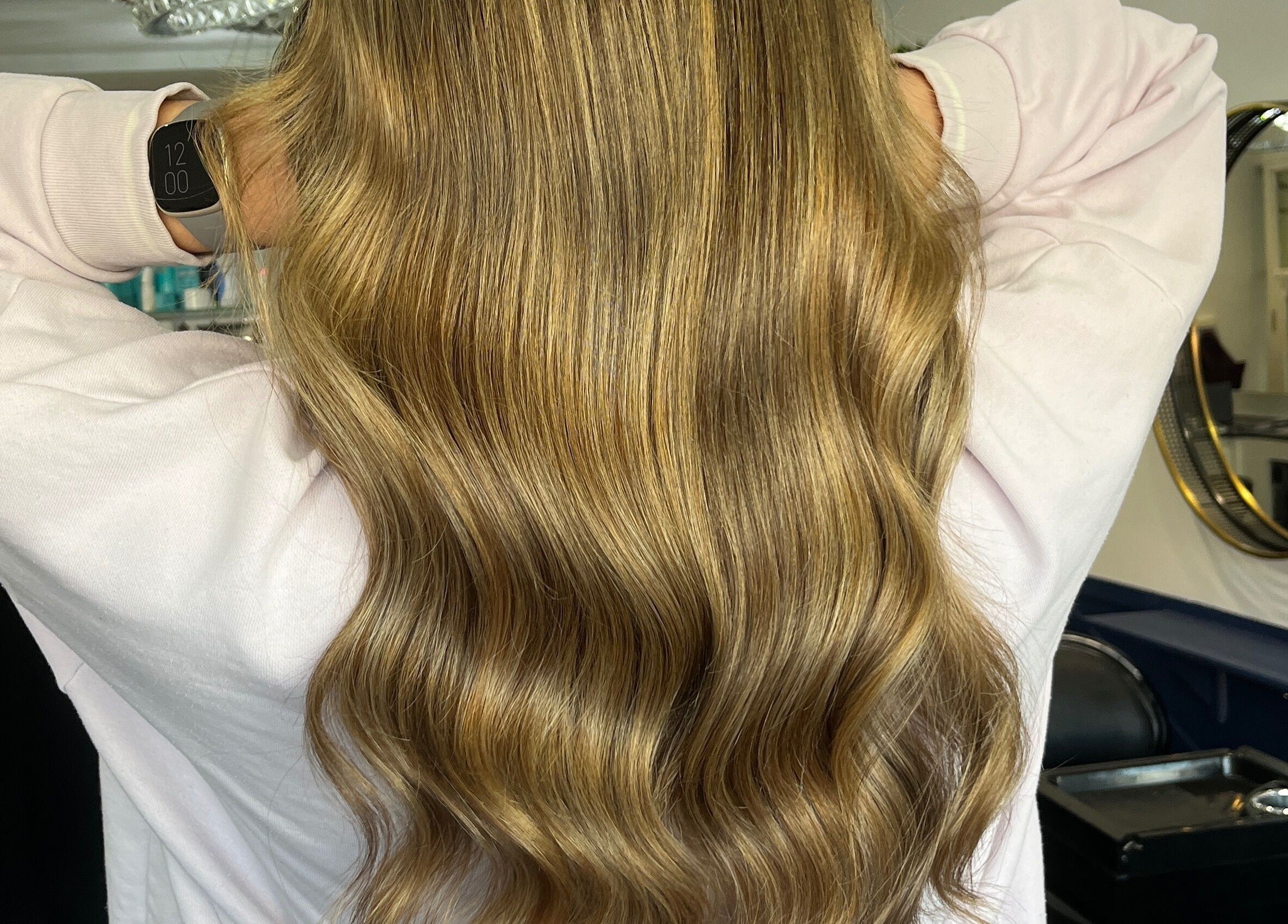 Elegant wavy blonde hair styled at JR Hair Studio, Walnut Tree, England, GB.