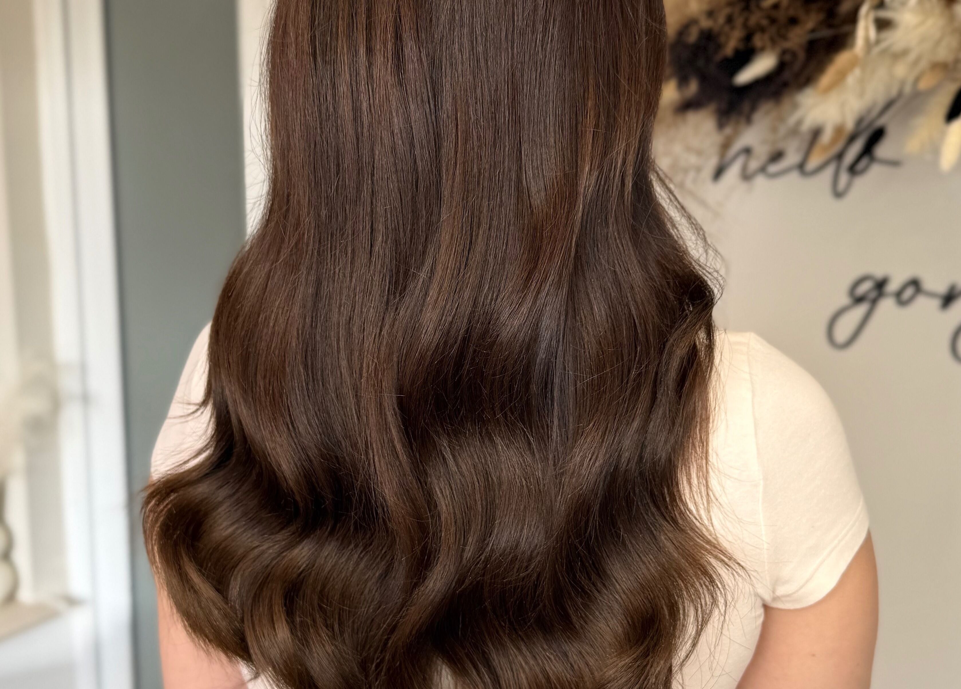 Glossy brown waves at JR Hair Studio, Walnut Tree, England, GB, showcasing expert hair styling services.