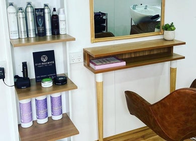 Modern salon interior at The Organic Hair Van, Bulgarra, WA, showcasing eco-friendly hair products and decor.