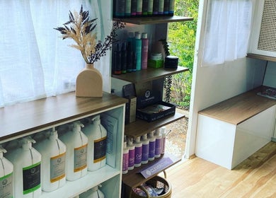 Stylish product shelves inside The Organic Hair Van in Bulgarra, Western Australia, AU, showcasing eco-friendly beauty.