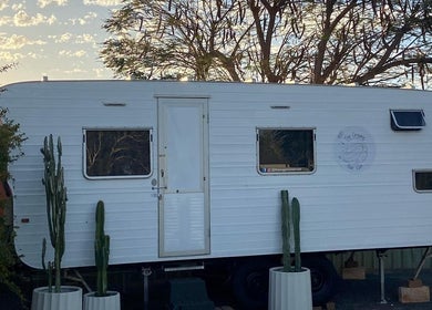 The Organic Hair Van in Bulgarra, Western Australia, offering unique mobile beauty services with a cactus-lined exterior.