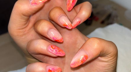 Elegant pink and orange abstract nails at CB Nails&Beautyx, Gateshead, England, GB. Perfect for a stylish look.