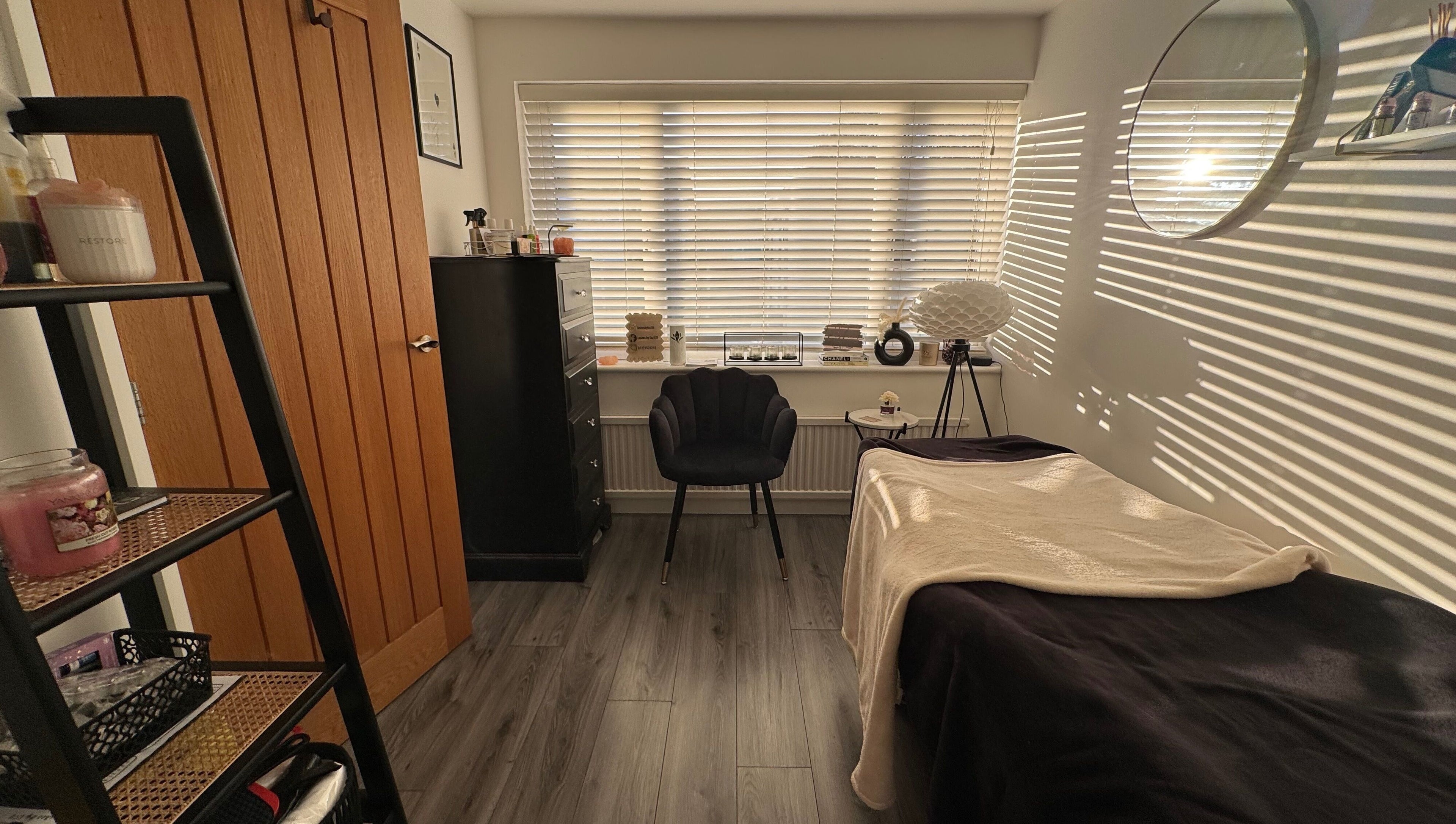 Cozy beauty room at Lashes by Loz LTD, Langdon Hills, England, GB, featuring a treatment bed and stylish decor.