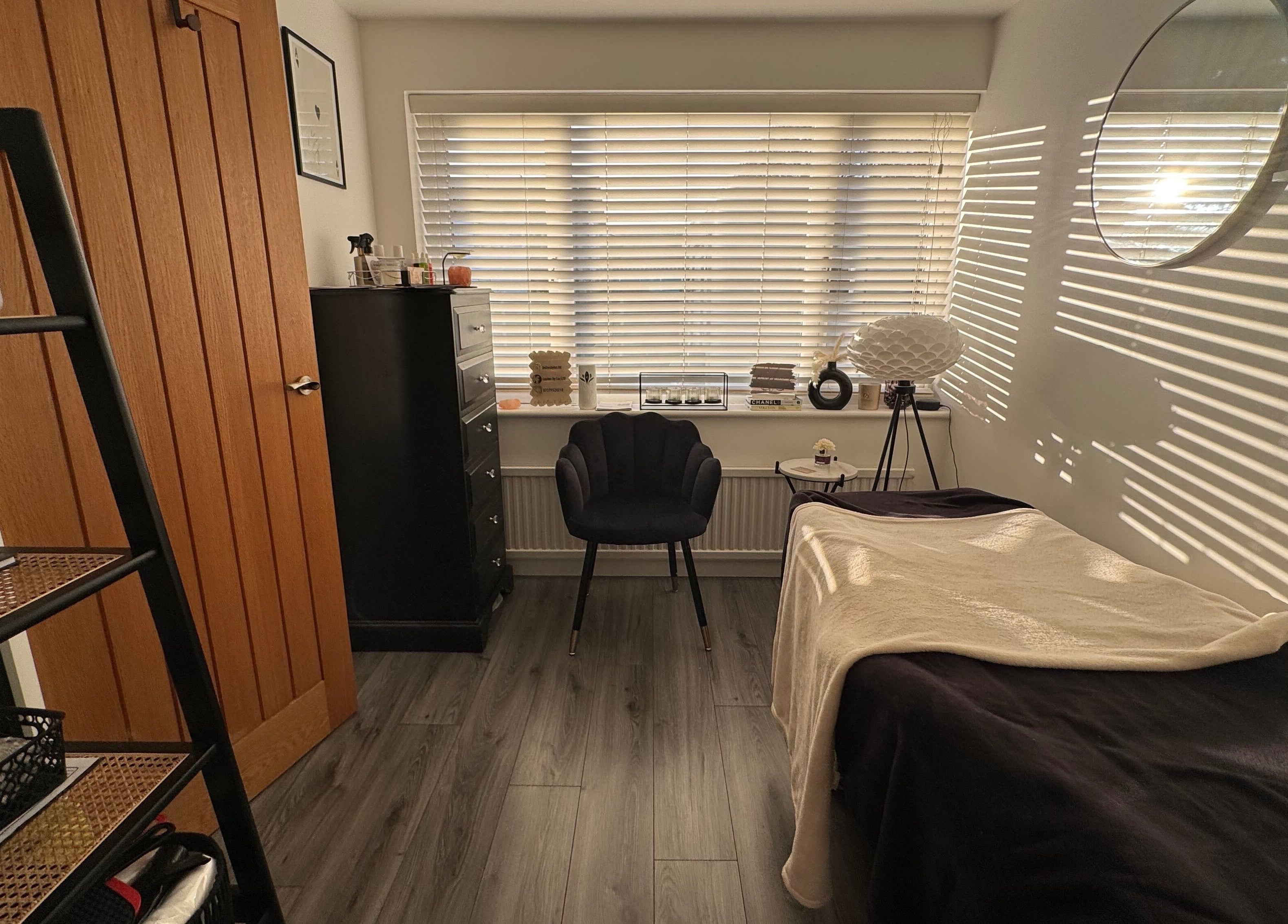 Cozy beauty room at Lashes by Loz LTD, Langdon Hills, England, GB, featuring a treatment bed and stylish decor.