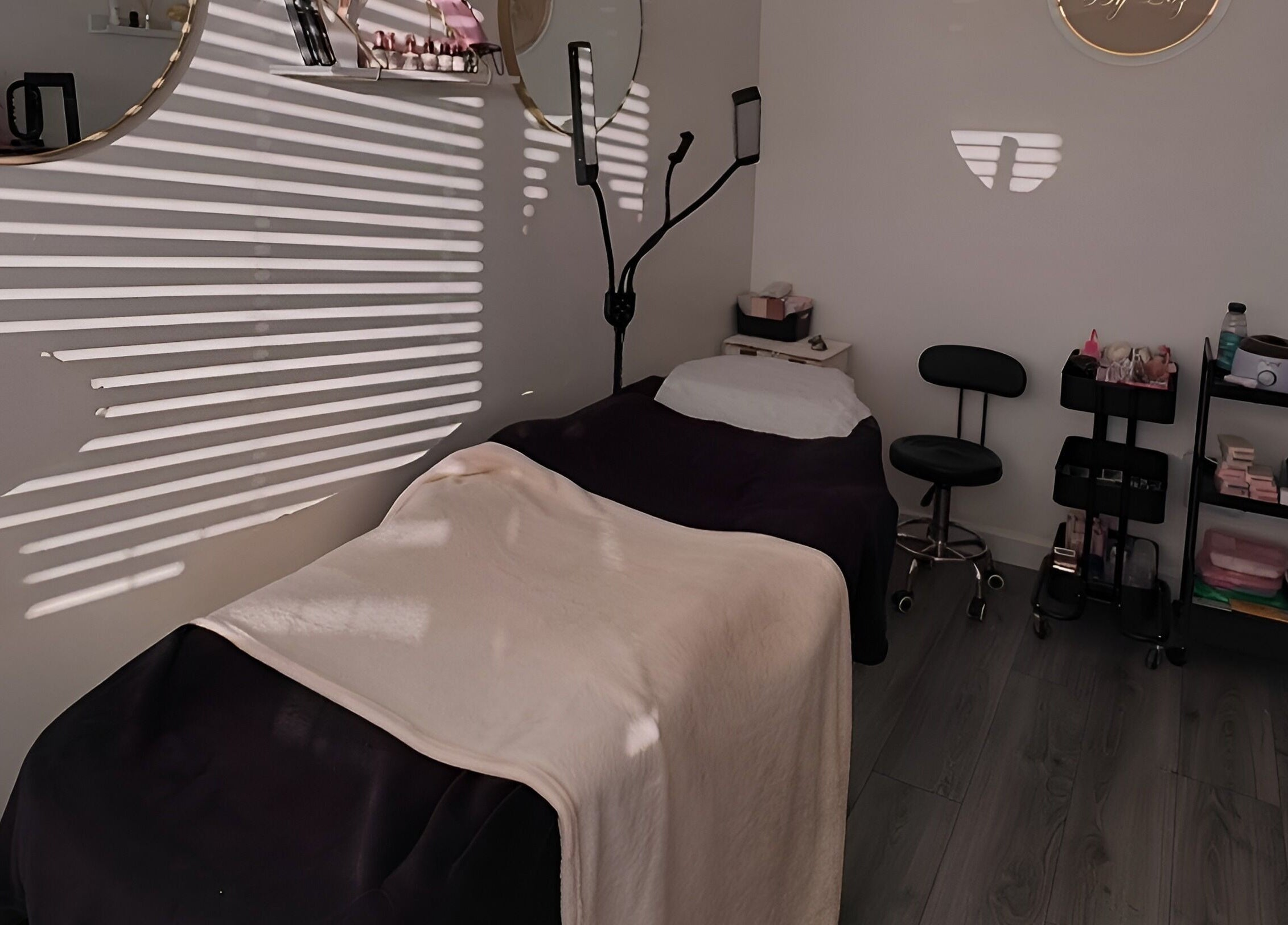 Relaxing treatment room at Lashes by Loz LTD in Langdon Hills, England, with cozy bed and beauty tools.