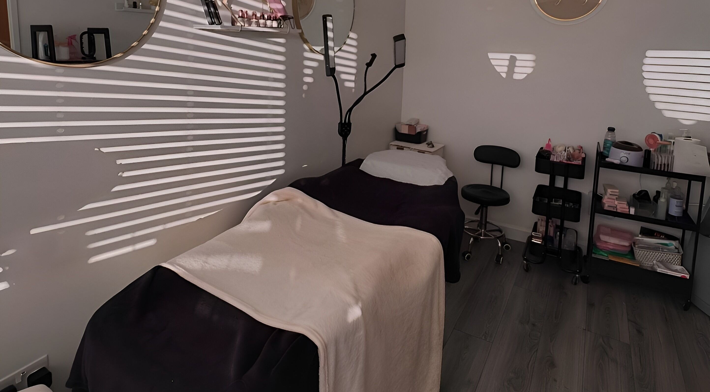 Relaxing treatment room at Lashes by Loz LTD in Langdon Hills, England, with cozy bed and beauty tools.
