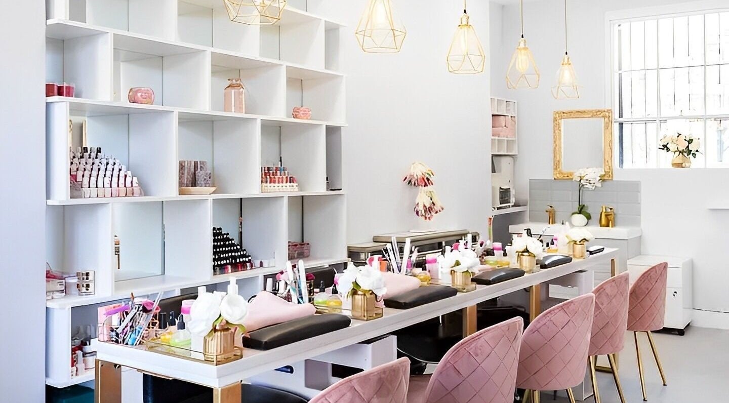 Stylish interior of NailBase London, a beauty venue in London, England, GB, featuring elegant manicure stations.