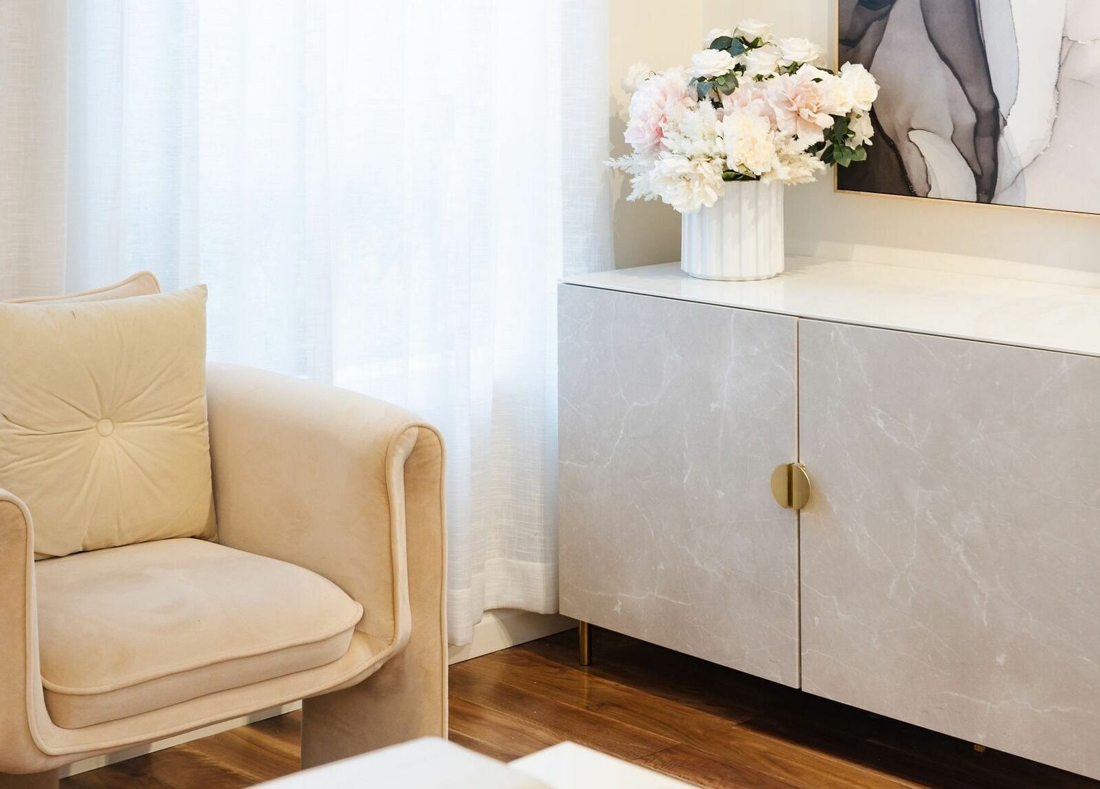 Elegant beige chair and flowers at Nails with Mimi, Earlwood, New South Wales, AU.