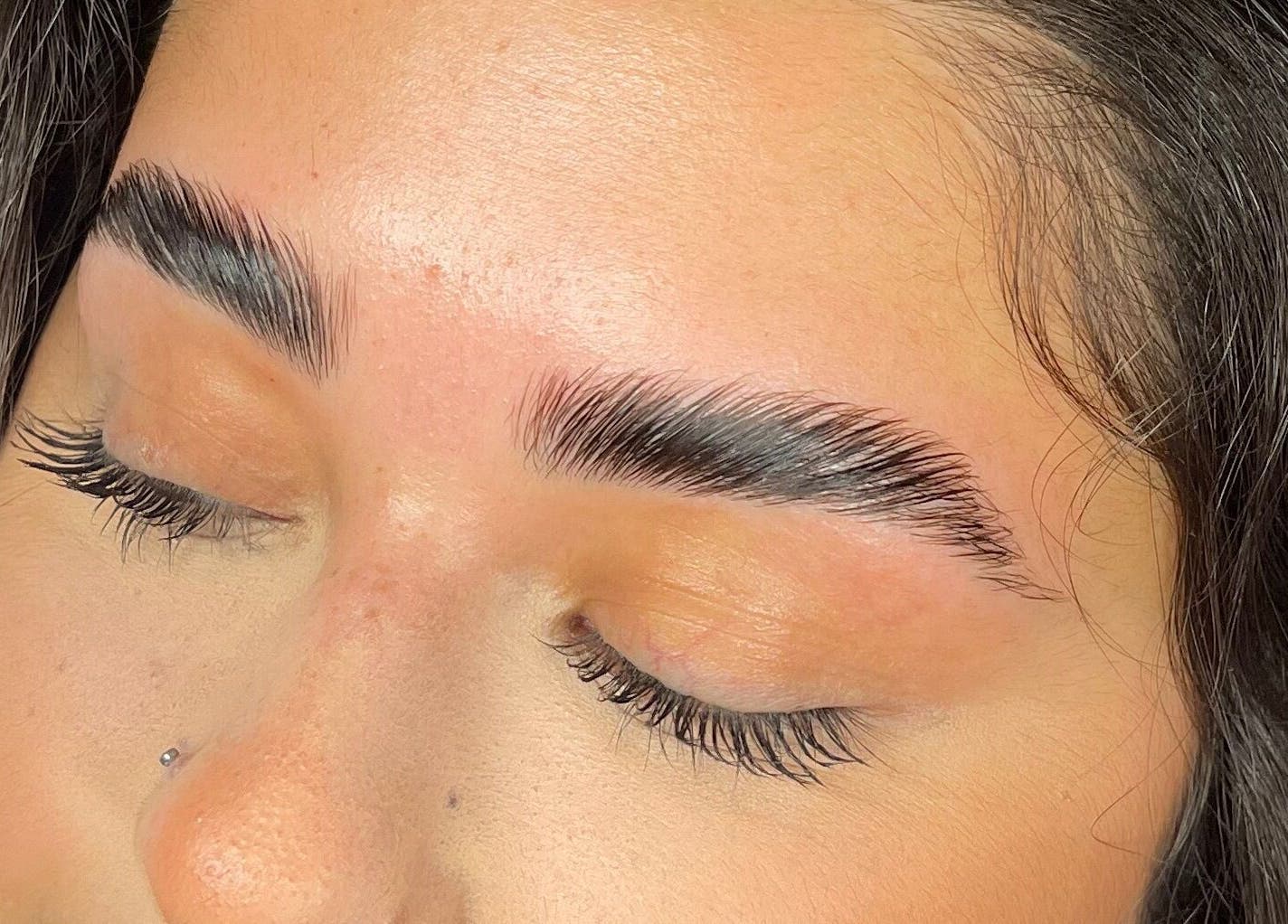 Expertly groomed eyebrows at Arooj London, London, England, GB, showcasing fine beauty and wellness service.