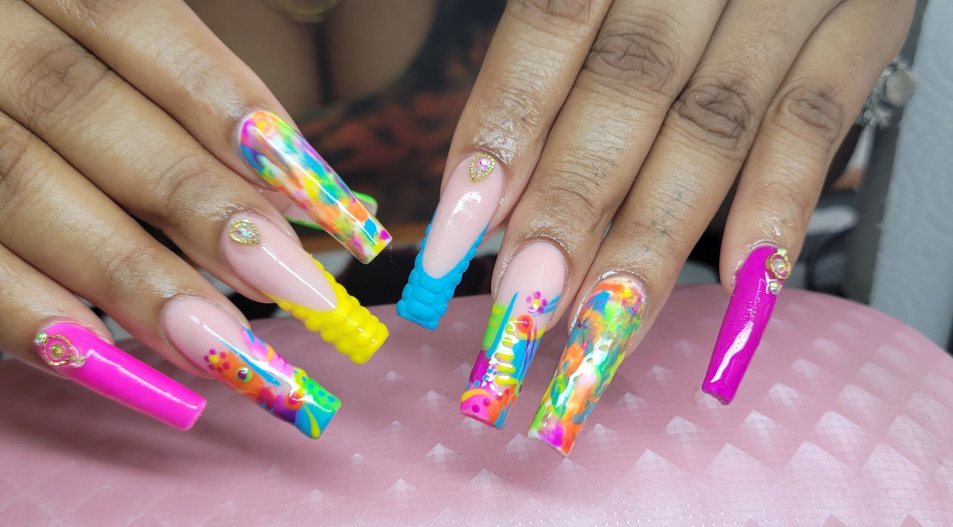 Vibrant nail art design at Jojo's NailZ in Roseau, Saint George Parish, DM, showcasing colorful, intricate patterns.