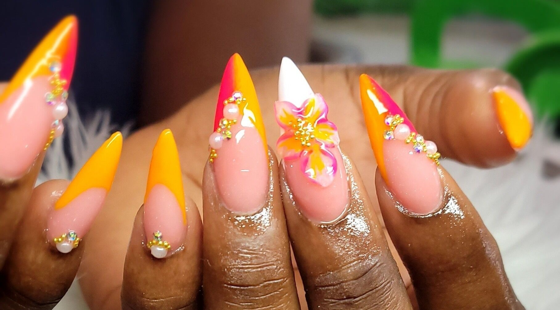 Bright floral nail art with gems at Jojo's NailZ, Roseau, Saint George Parish, DM.