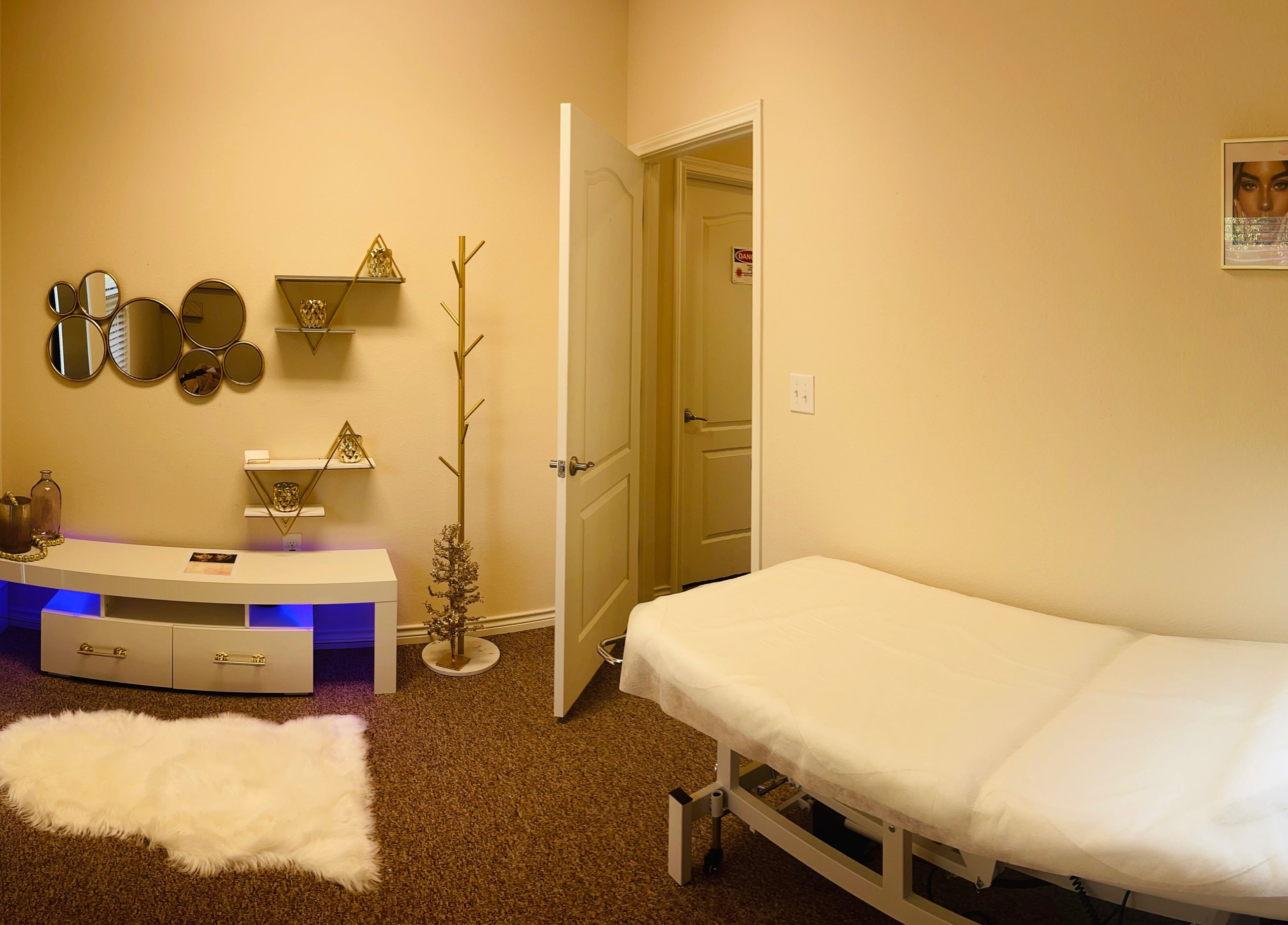 Tranquil room at La Belleza Lash Studio, Cedar Park, Texas, US featuring a cozy massage bed and stylish decor.