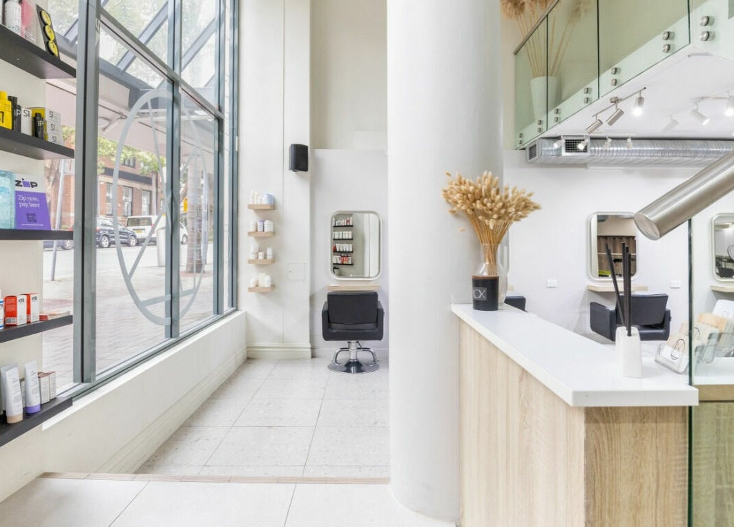 Chic interior of House of Lox Neutral Bay, showcasing modern salon chairs and products, Neutral Bay, New South Wales, AU.