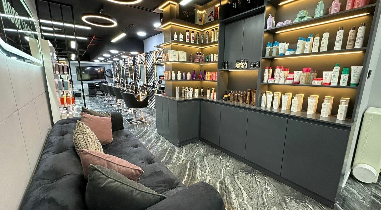 Elegant interior of Noor Beauty Salon | Beach Rotana featuring products and seating, Abu Dhabi, AE.