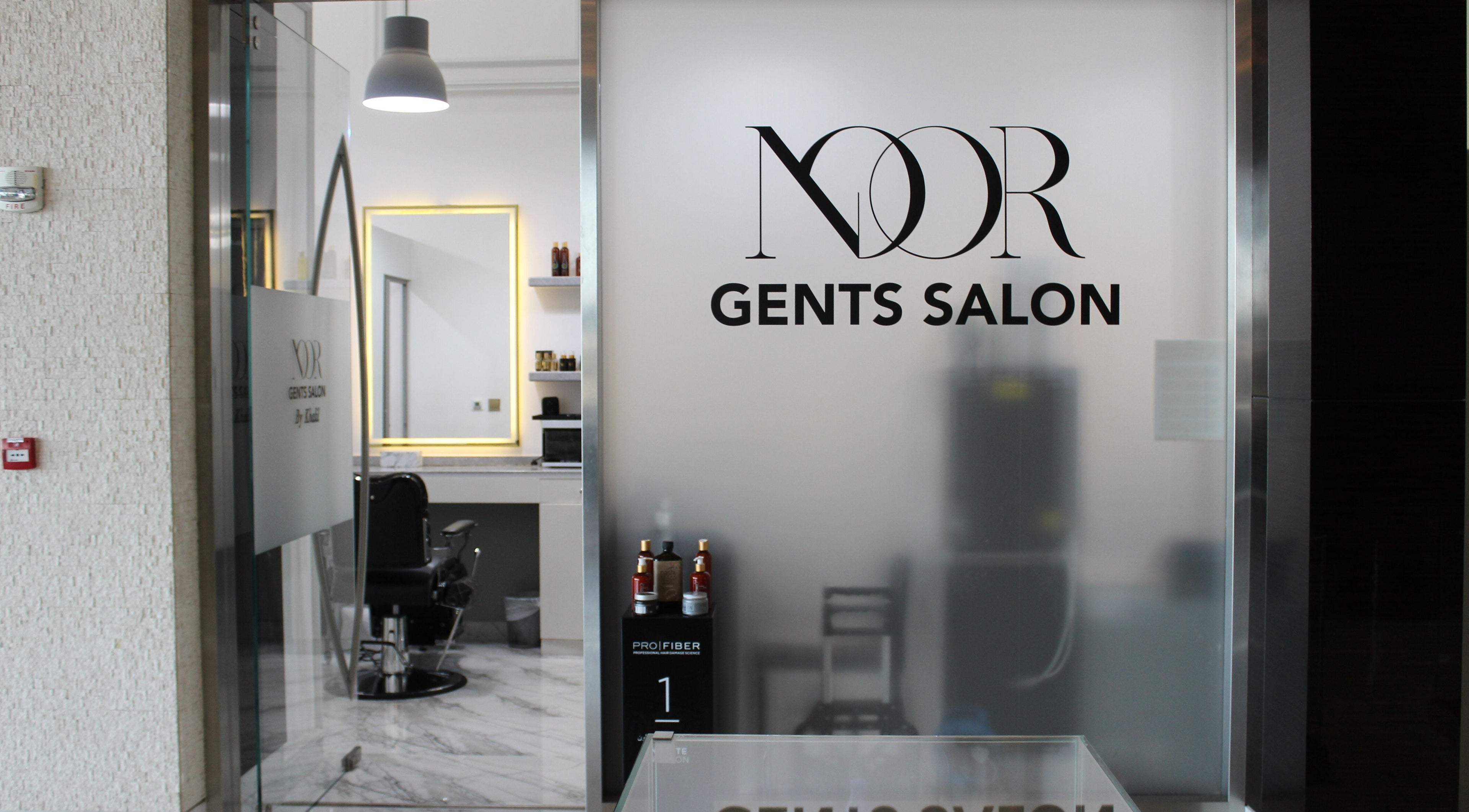 Entrance of Noor Elasr Gents Salon at Marriot Al Forsan, Abu Dhabi, AE, showcasing elegant interior.
