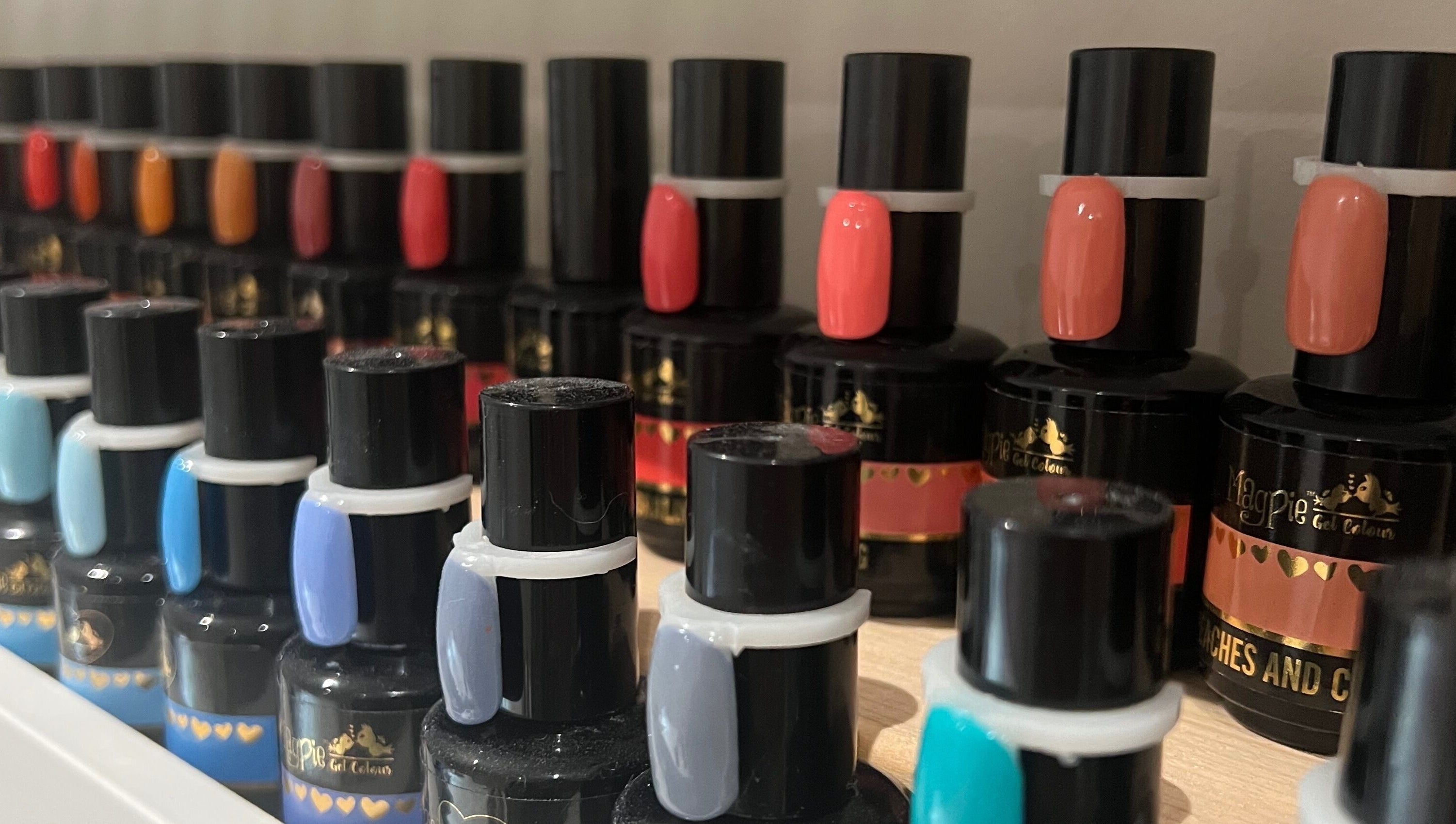 Colorful nail polish collection at Nails by Laura, Chesterfield, England, GB, showcasing vibrant shades.