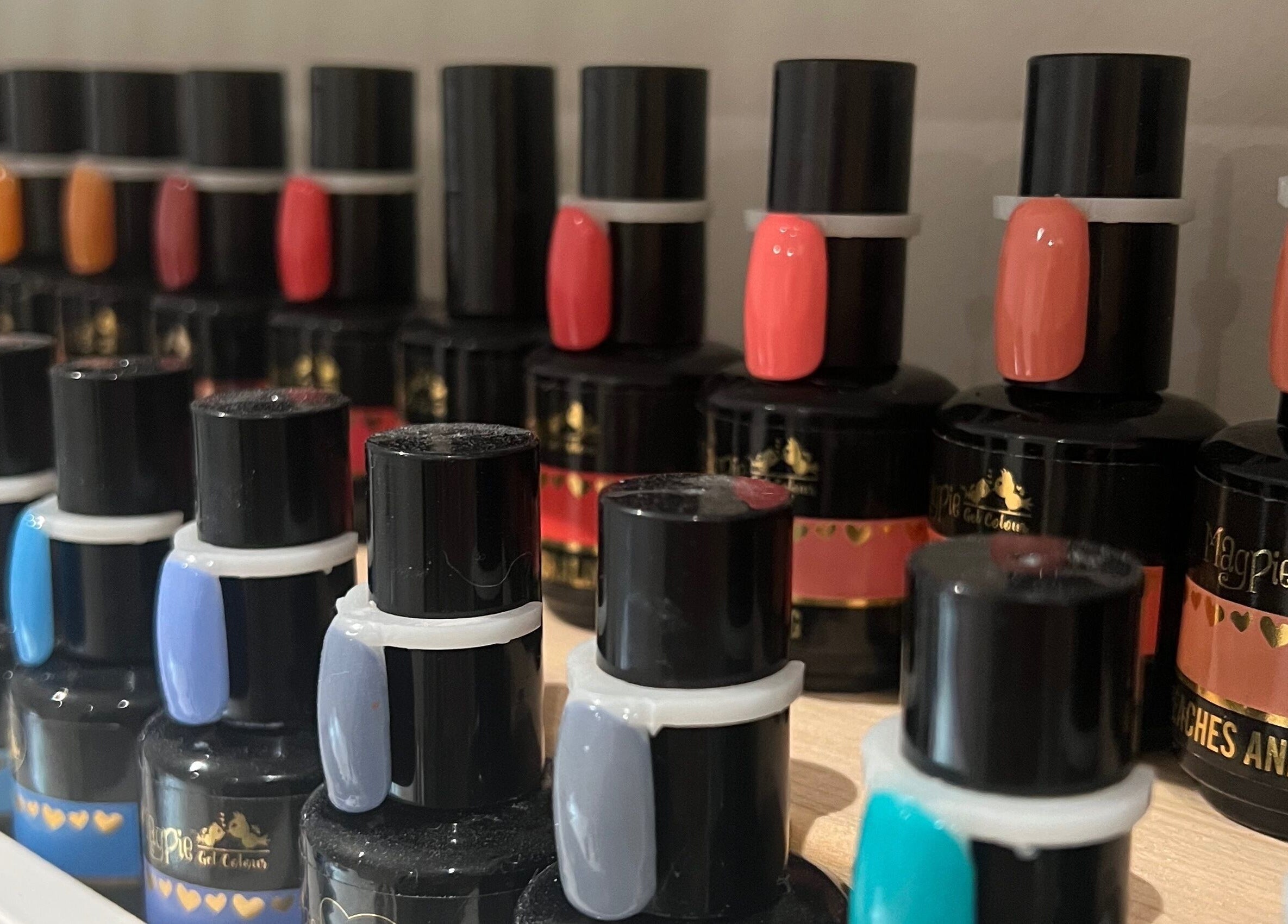 Colorful nail polish collection at Nails by Laura, Chesterfield, England, GB, showcasing vibrant shades.