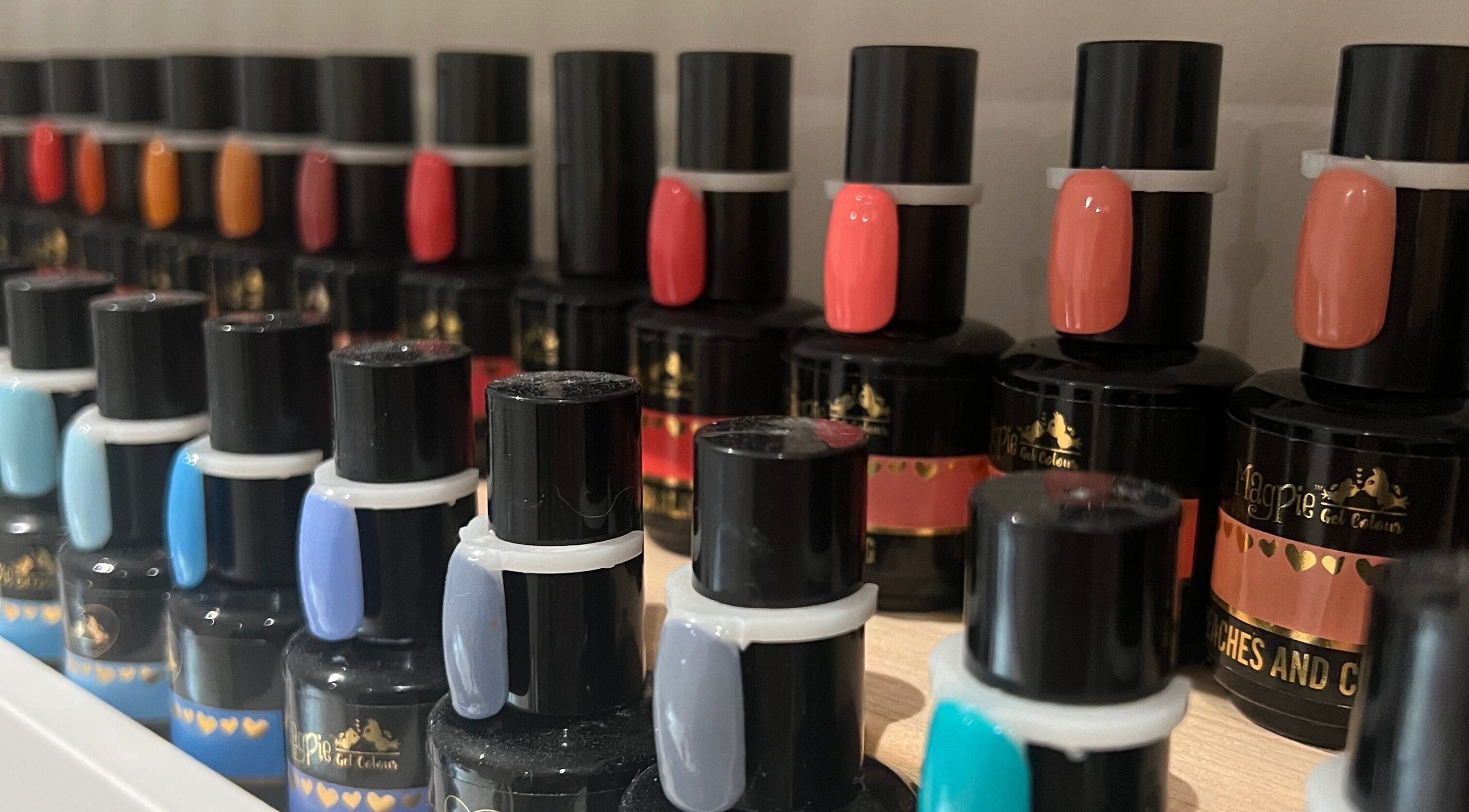 Colorful nail polish collection at Nails by Laura, Chesterfield, England, GB, showcasing vibrant shades.