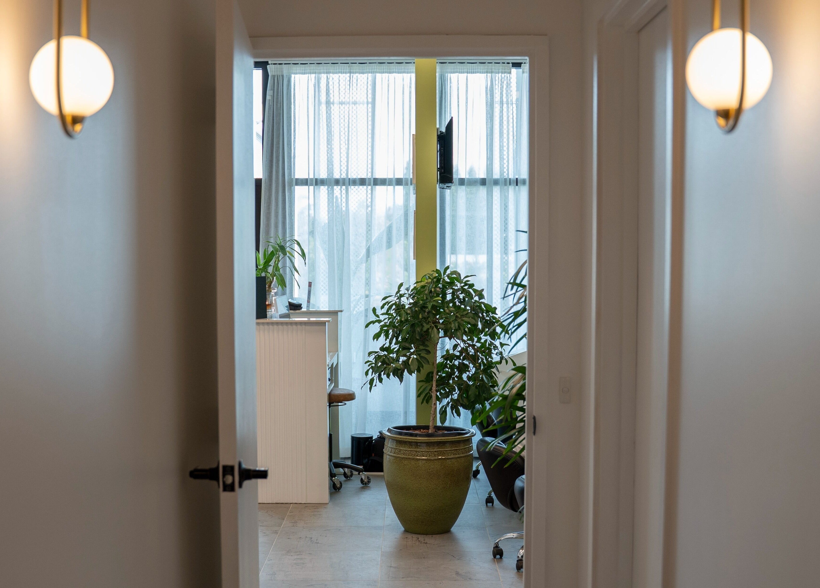 Elegant hallway at The House of Beauty (Nadi), showcasing plants and natural light in Nadi, Western Division, FJ.