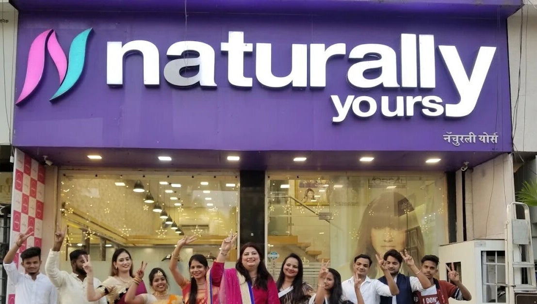 Team celebrating outside Naturally Yours Salon, Navi Mumbai, Maharashtra, IN.