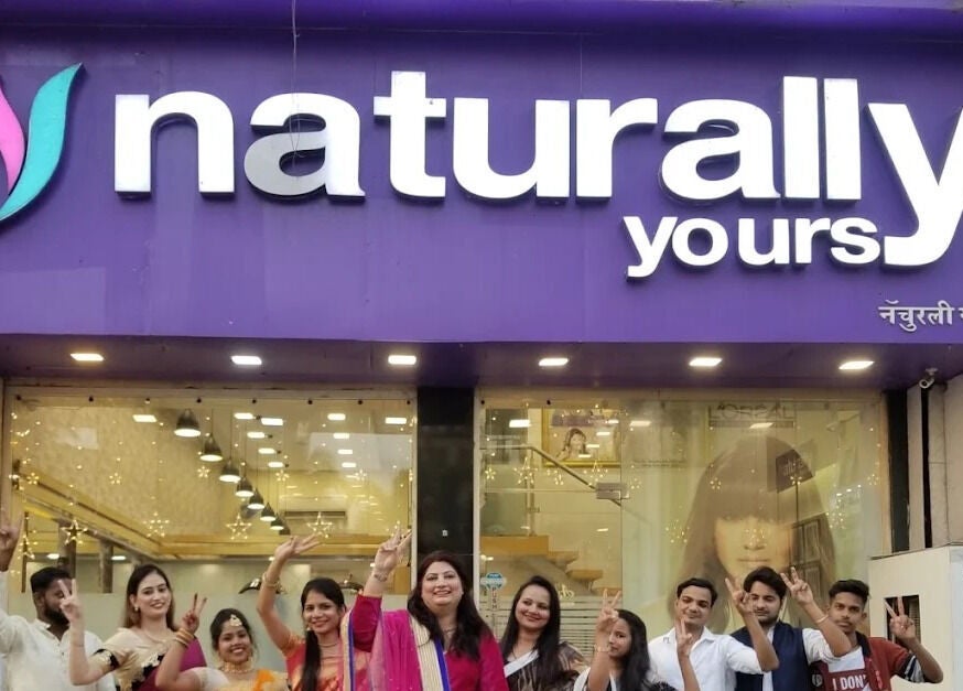 Team celebrating outside Naturally Yours Salon, Navi Mumbai, Maharashtra, IN.