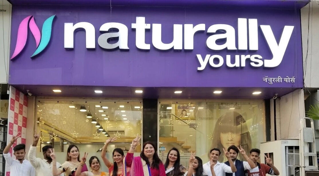 Team celebrating outside Naturally Yours Salon, Navi Mumbai, Maharashtra, IN.