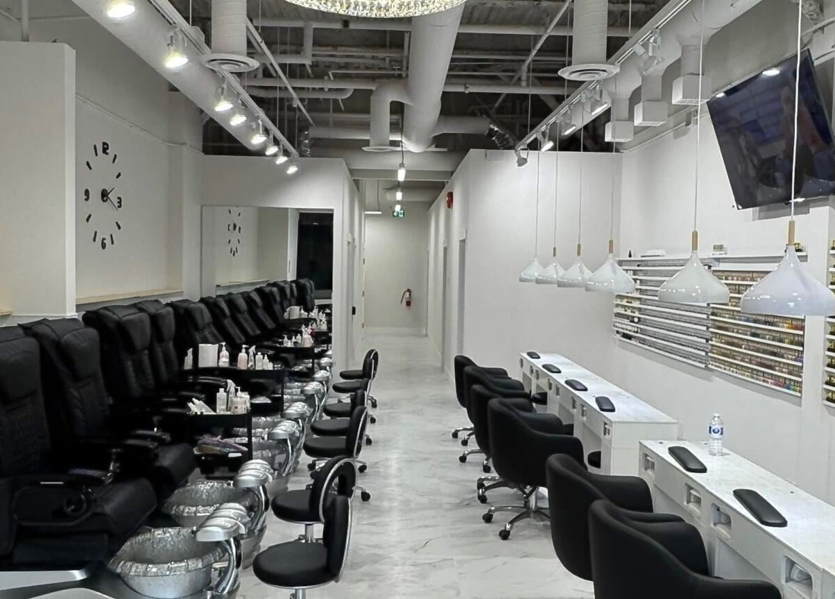 Inside view of Creative Nails and Esthetics, Burnaby, BC, CA showing luxurious nail stations and pedicure chairs.
