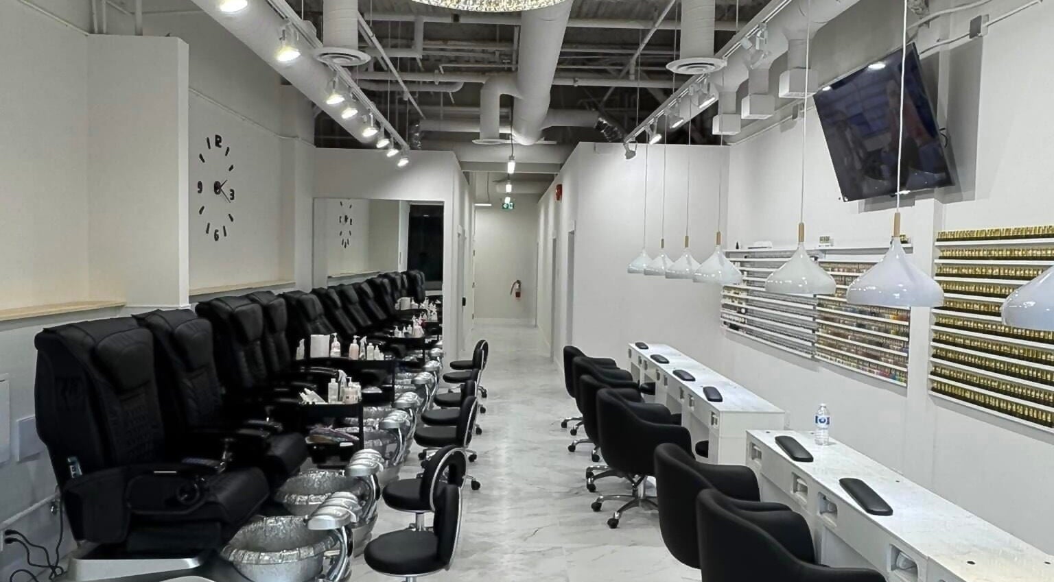 Inside view of Creative Nails and Esthetics, Burnaby, BC, CA showing luxurious nail stations and pedicure chairs.