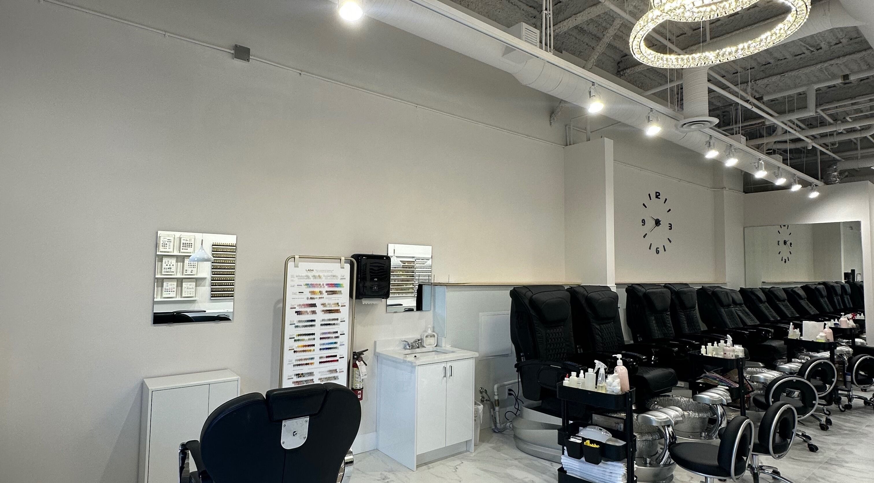 Spacious nail salon at Creative Nails and Esthetics in Burnaby, BC, CA, featuring modern pedicure chairs.