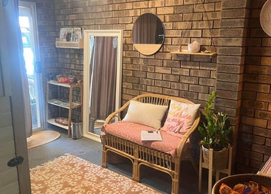 Inviting lounge at Sunset Salt Therapy, Sunset Beach, Western Australia, AU, featuring rustic decor and warm ambiance.