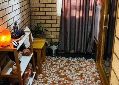 Warm interior of Sunset Salt Therapy in Sunset Beach, Western Australia, AU with salt lamp and decor.