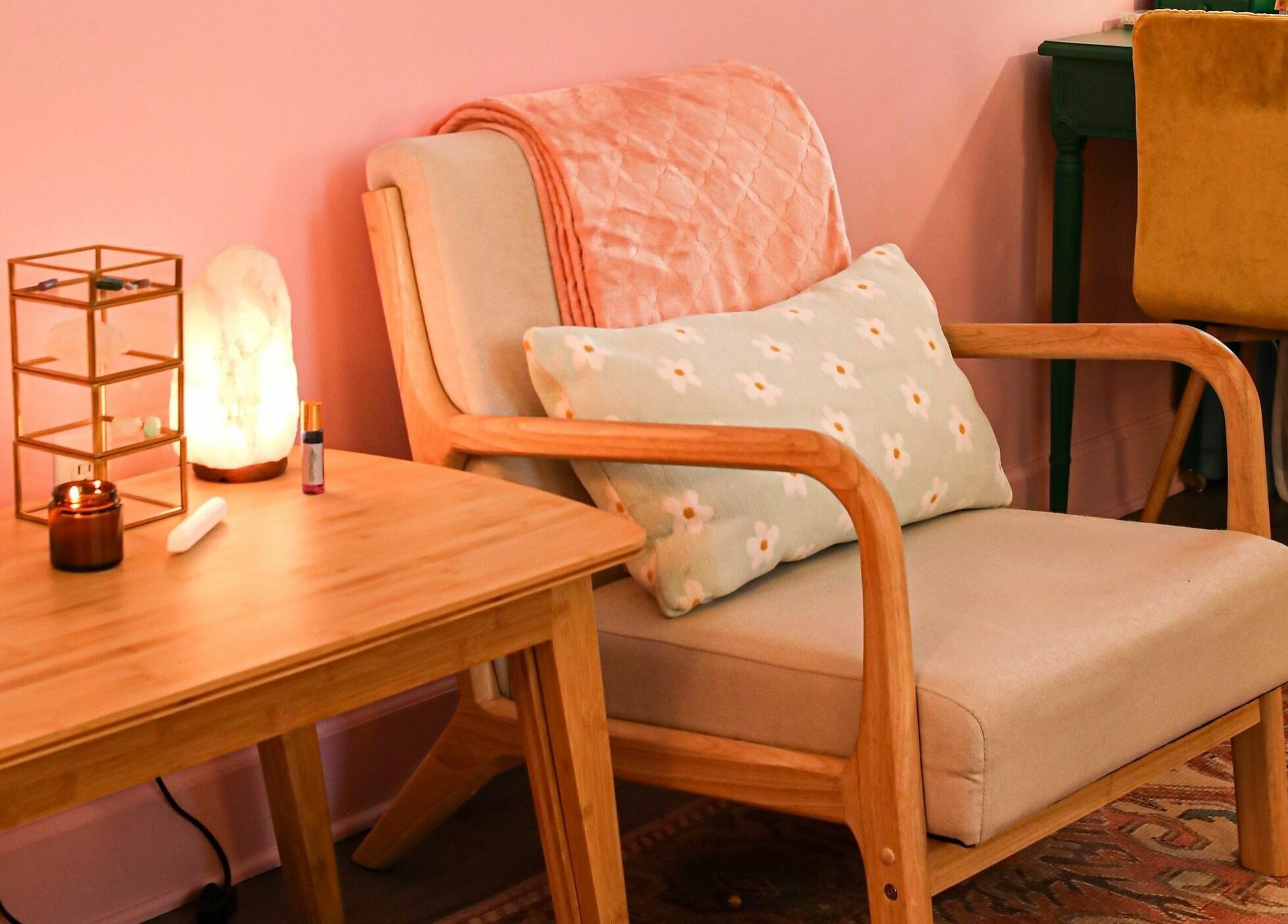 Relaxation nook in ASHI Bodywork, Stuart, Florida, US, featuring a plush chair and ambient decor.