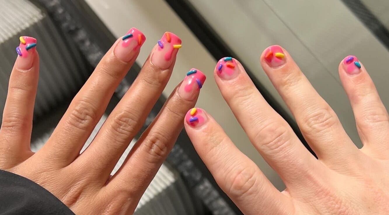 Colorful nail art with sprinkles at KTF Studios, Cardiff, Wales, GB.