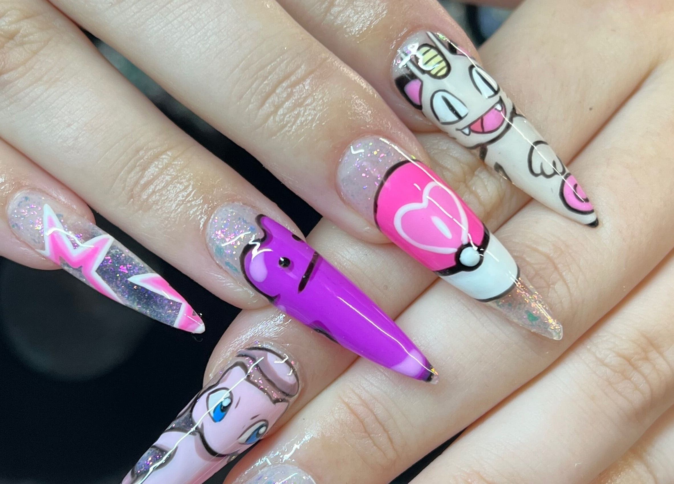 Colorful cartoon-themed nail art at KTF Studios, Cardiff, Wales, GB showcasing unique designs.