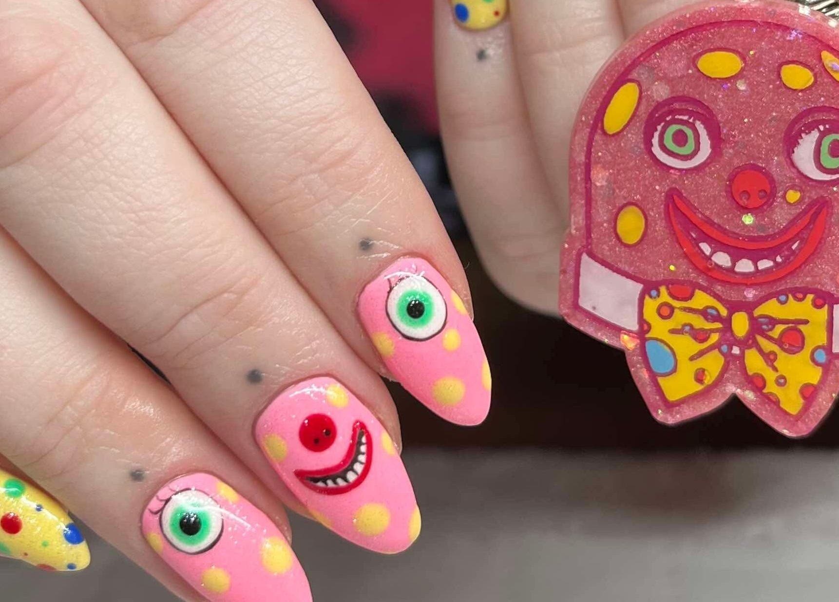 Colorful nail art with smiley faces at KTF Studios, Cardiff, Wales, GB.